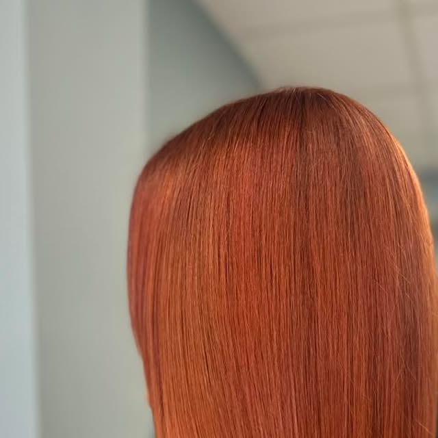 Straight, shiny copper hair
