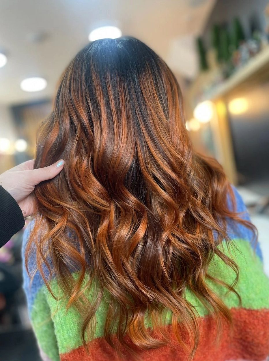 Long copper-brunette balayage waves