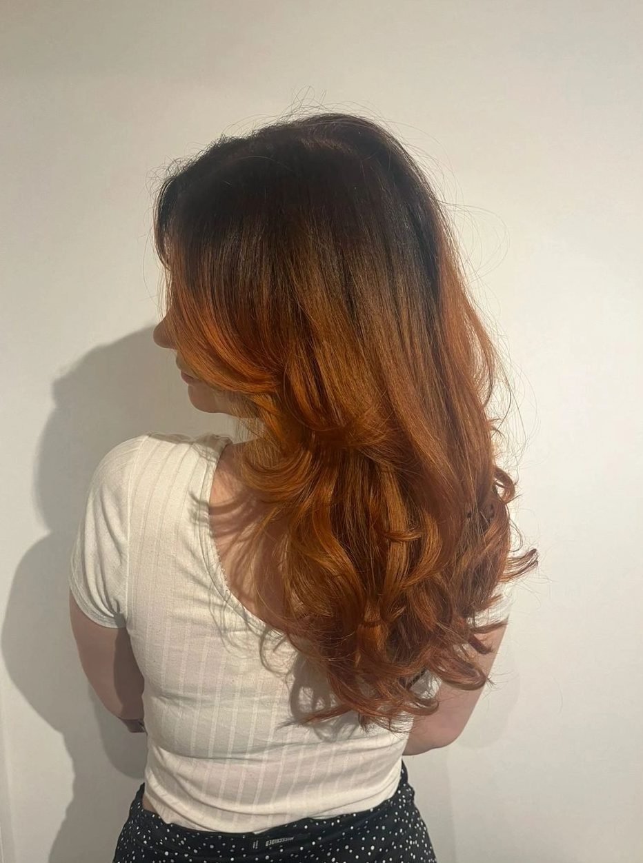 Dark roots melting into copper lengths